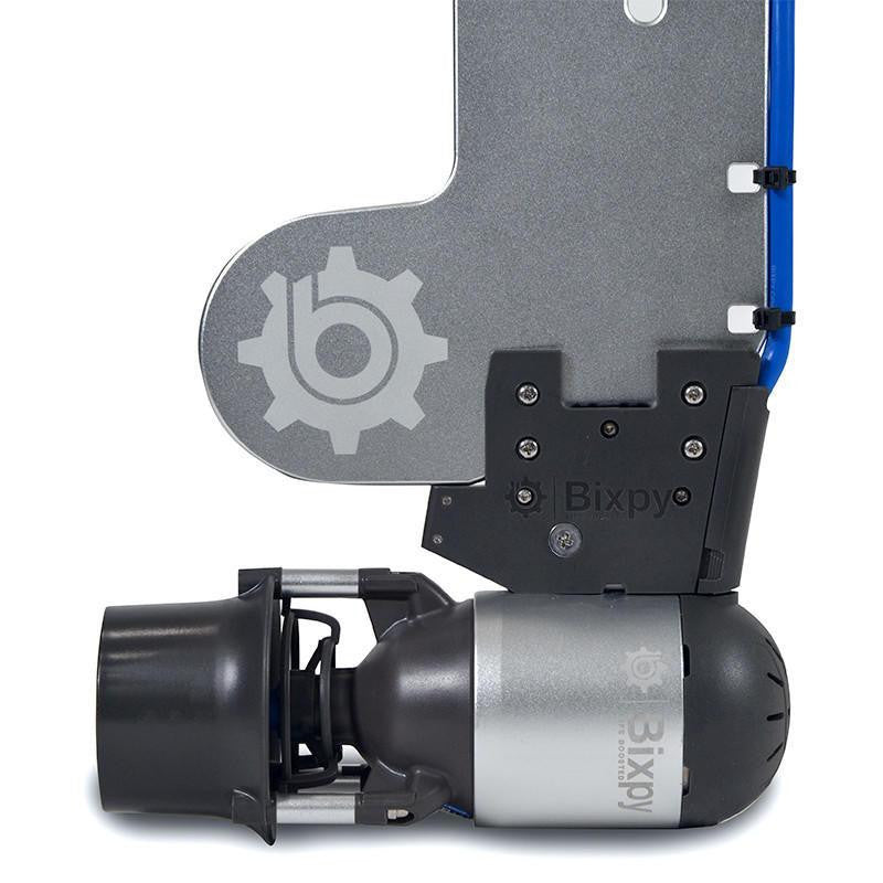 Close-up, bottom view of a Bixpy Jet electric motor connected to the lower section of a gray Bixpy Versa Rudder, showing mounting details.