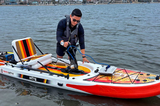 Man places Bixpy Canada motor into BOTE paddle board