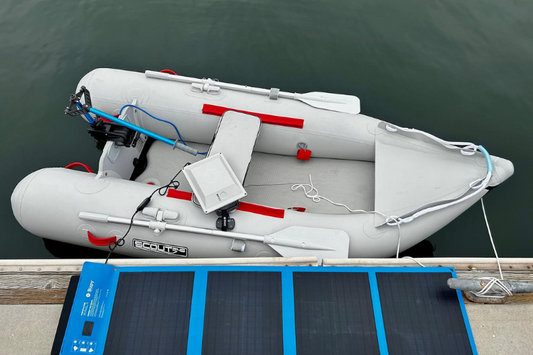 Inflatable boat with Bixpy K-1 and PP-78 featuring the solar panel charging it all before heading out