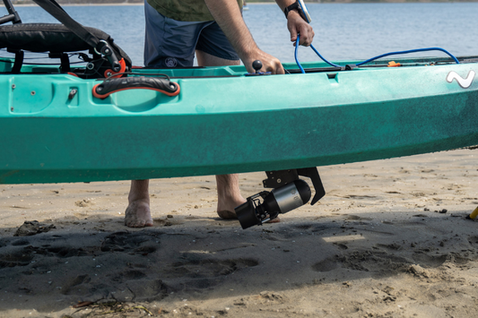 Man securing outboard motor on personal watercraft