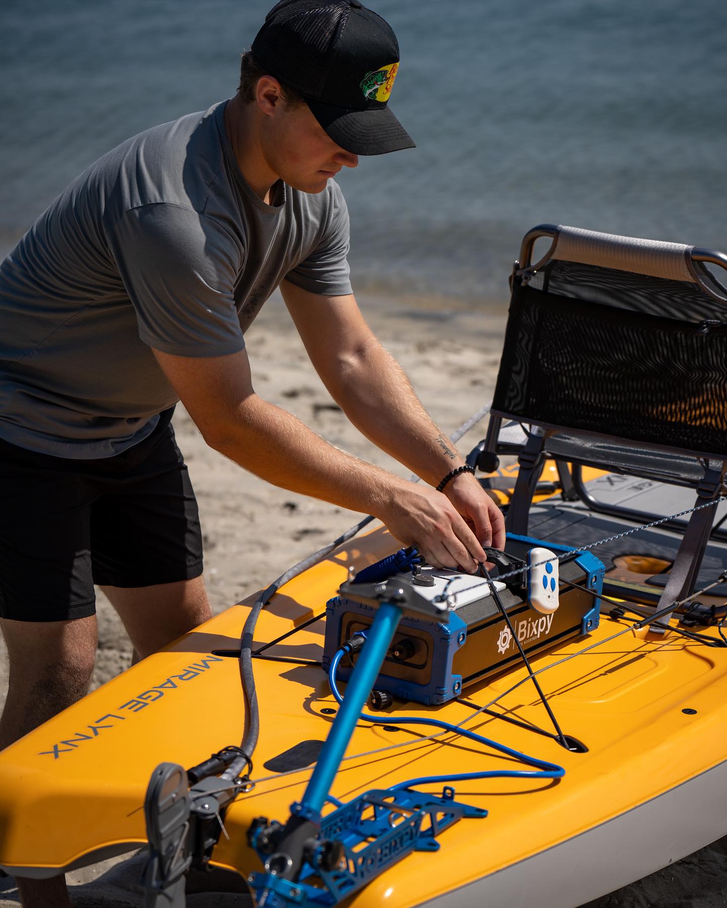 Bixpy outboard battery being secured on watercraft