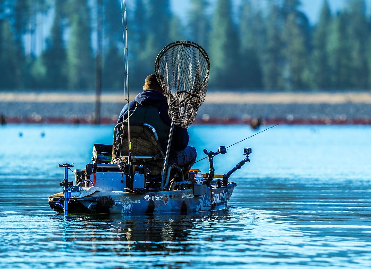 Back of guy using a Bixpy motor to navigate winter waters