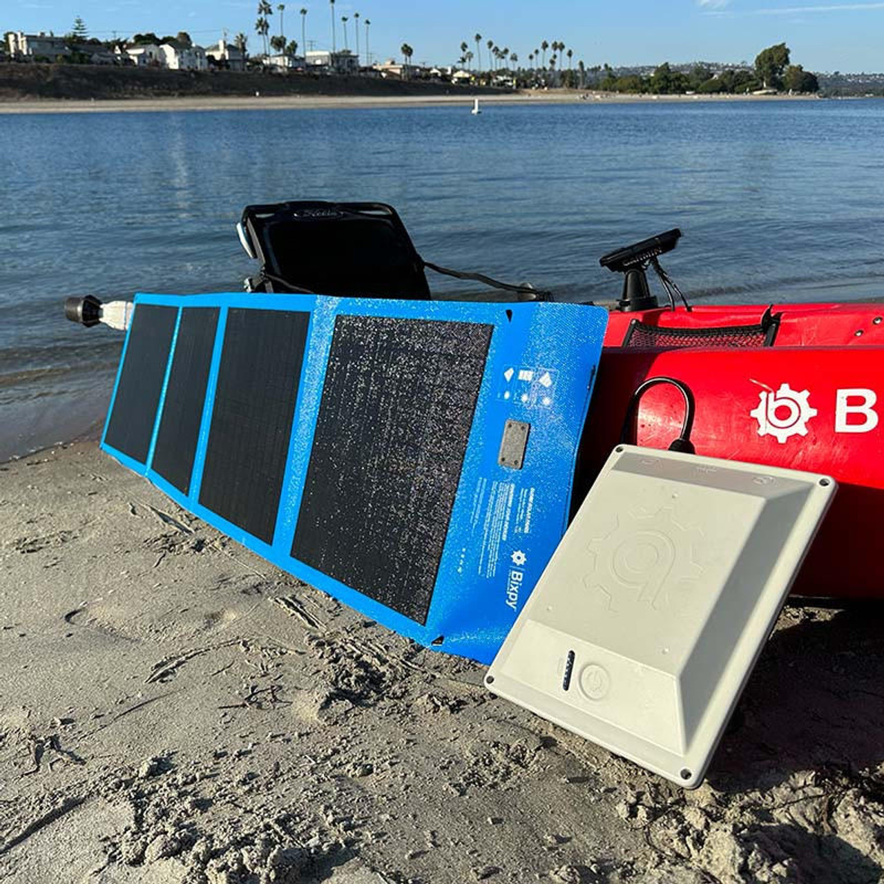 Solar panels laid out on kayak to charge in the sun