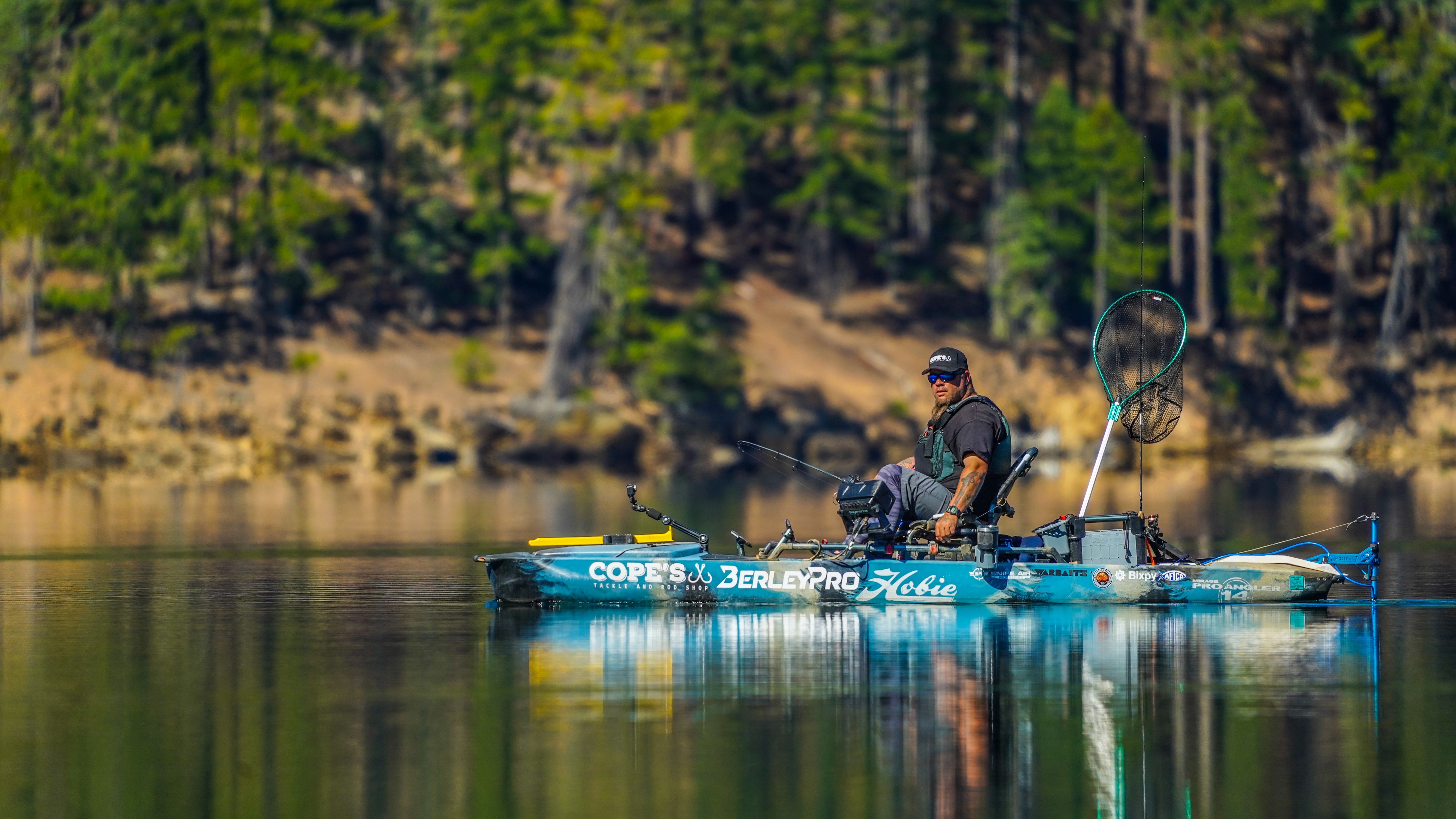 Man in kayak using Bixpy Motor